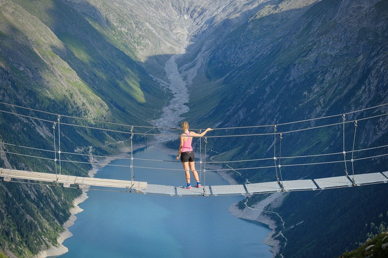 Crossing the bridge to a brighter, healthier future together eople joyfully running on a scenic bridge representing the journey of recovery